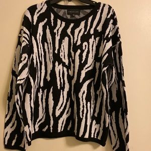 I’m selling a black and white sweater top